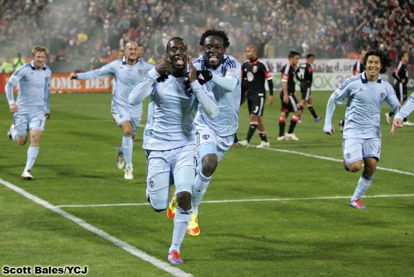 CJ Sapong celebrating with teammates during a match.